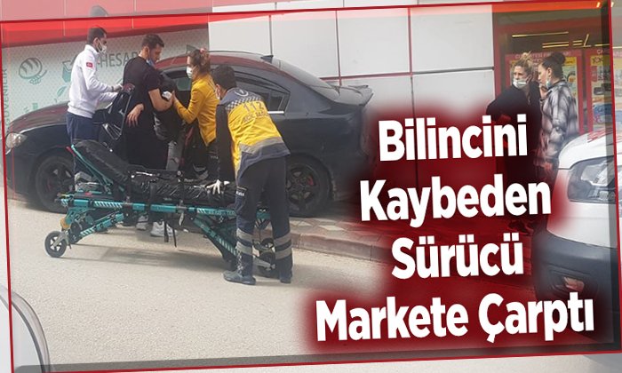 Bilincini kaybeden sürücü markete çarptı
