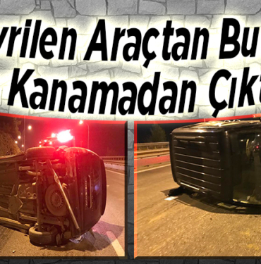 Devrilen otomobilden burnu kanamadan çıktılar