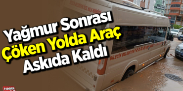 Yağmur sonrası çöken yolda araç askıda kaldı