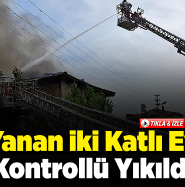 Yanan iki katlı ev kontrollü yıkıldı