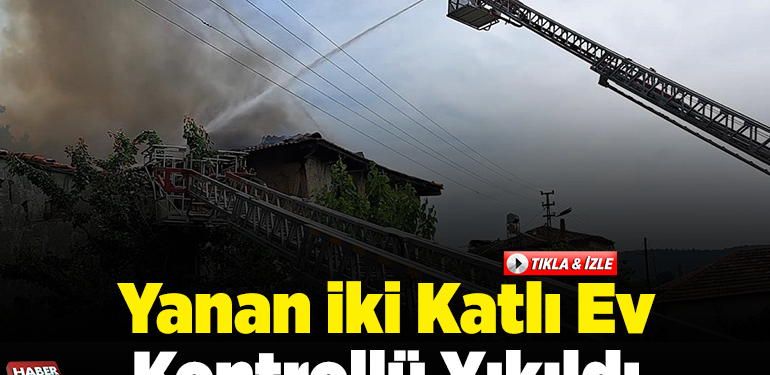 Yanan iki katlı ev kontrollü yıkıldı