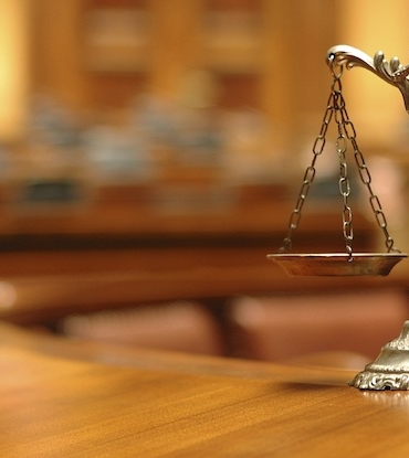 Symbol of law and justice in the empty courtroom, law and justice concept.
